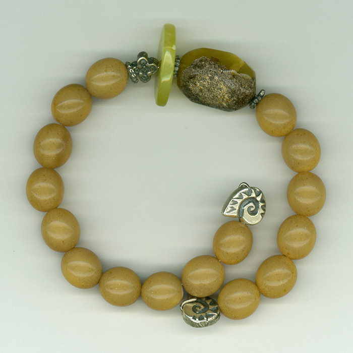 Bracelet made of genuine amber from Baltic sea ,thailand jade and silver.
