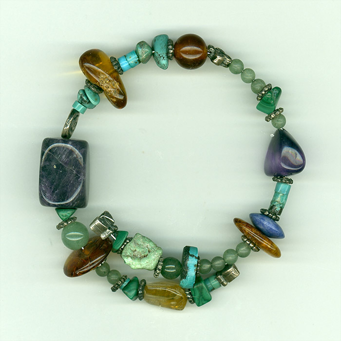 Bracelet made of solid turquoise, amethyst,genuine  Baltic Amber, lapis lazuli, malachite, quartz and silver.
