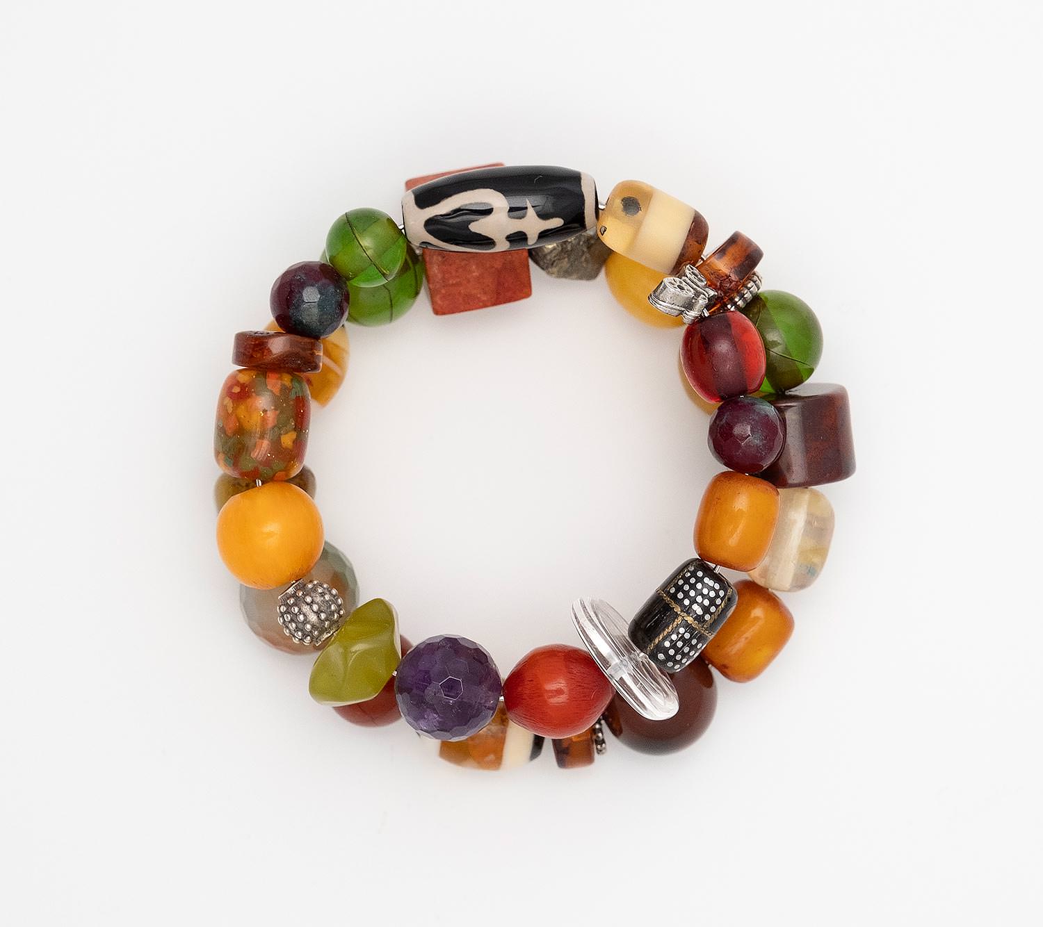 Bracelet with beads made of old mixture of artificial resins of Egypt (1960), Baltic Sea Amber (cut by hand), Water buffalo Horn with inlaid silver and bronze, Agates and tin
