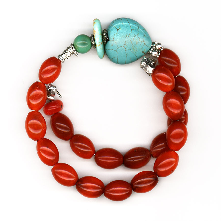 Bracelet made of artificial resin, turquoise, red coral, tin and silver.