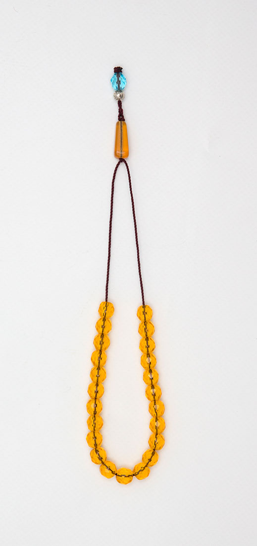 Komboloi-amulet made of crystal -  multi-edged (transparent golden - yellow)  personal strength