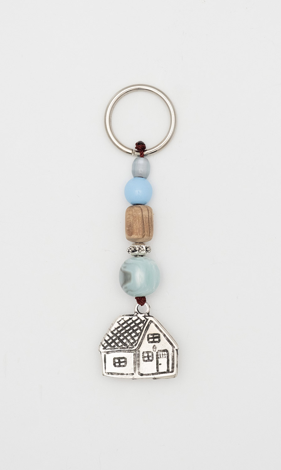 Keyring made of artificial resin and palisader  with Little House