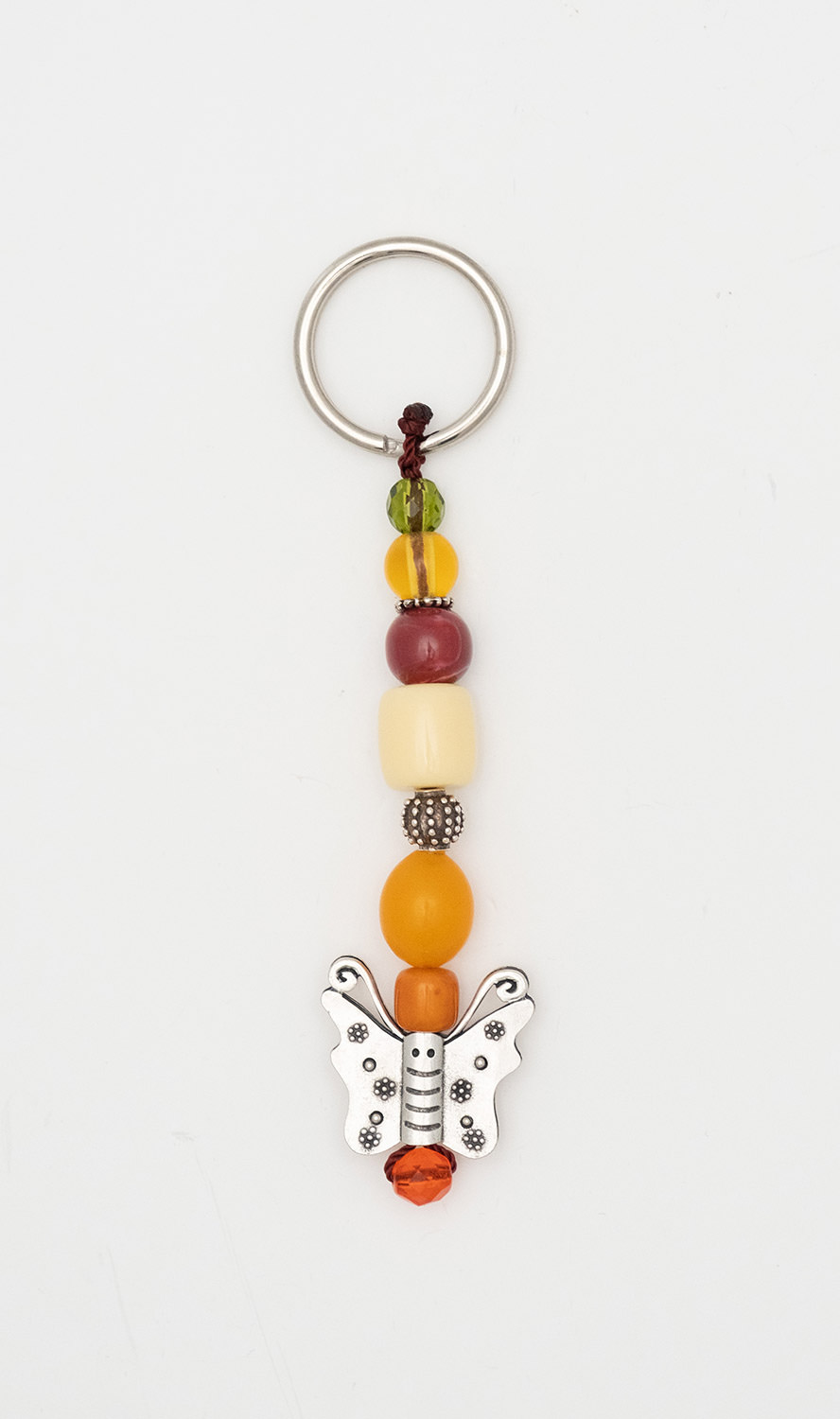 Keyring made of artificial resin and crystal with a butterfly