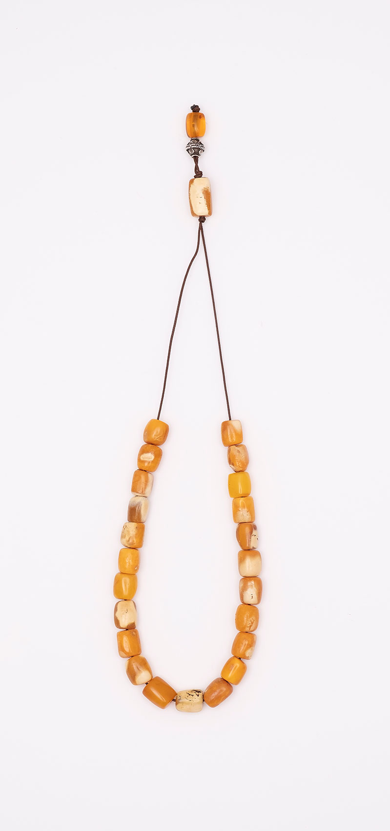 Komboloi made of genuine amber from Baltic sea- cut by hand .