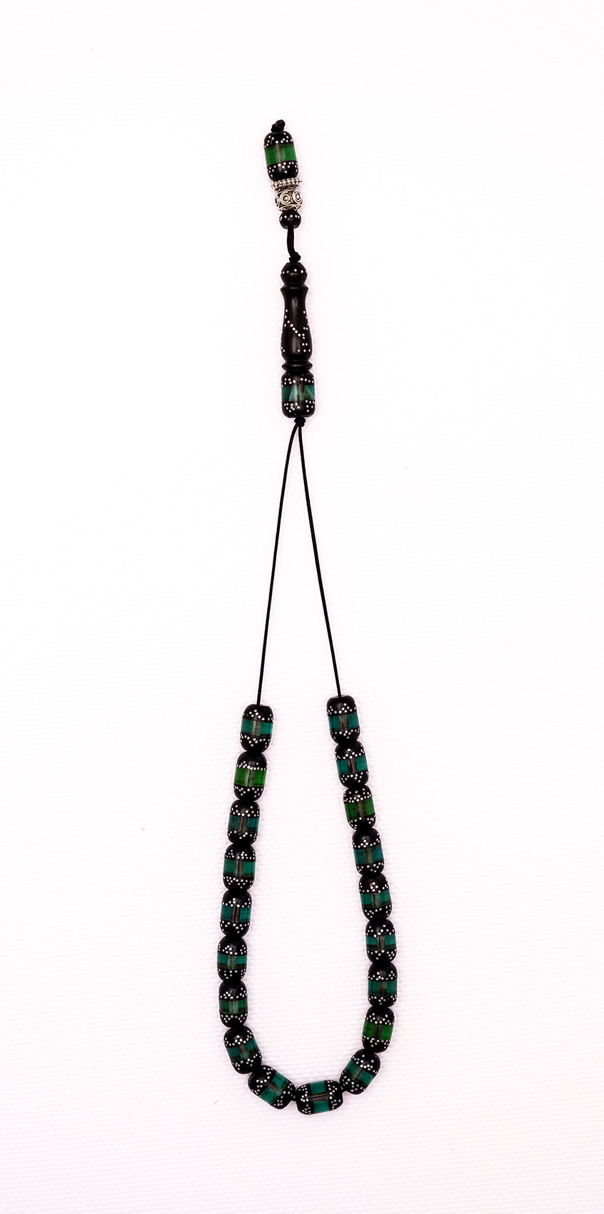 Ebony with artificial resin and silver (green).