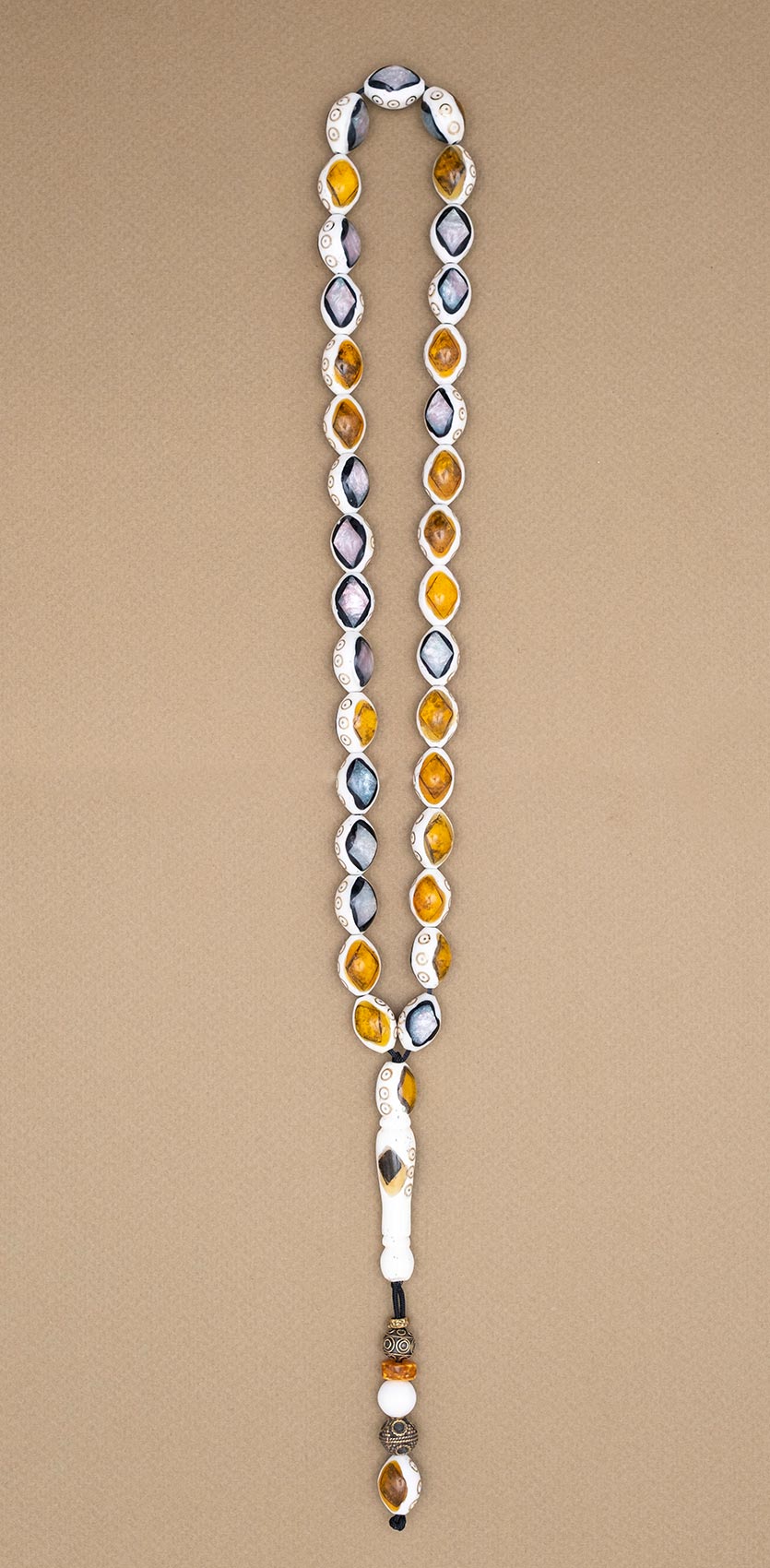 Muslim Prayer beads made of camel bone with inlaid enamel and bronze