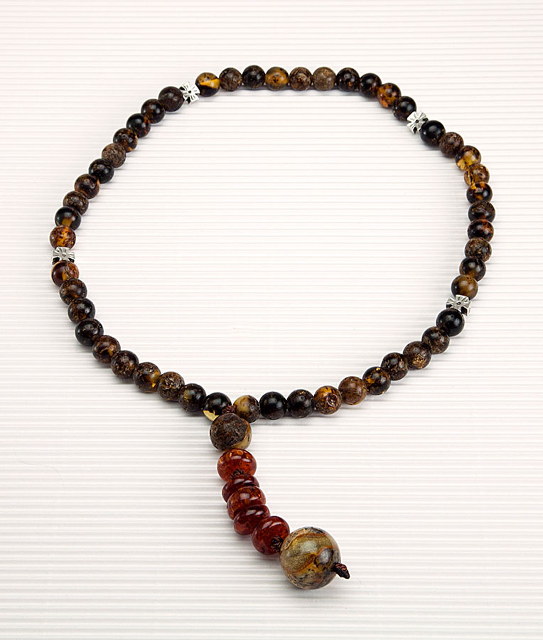 Catholic prayer object (Rosary) made of genuine amber from Baltic sea -(black)  - cut by hand and tin.