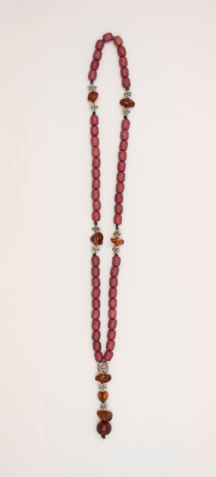 Catholic prayer beads (Rozary) made of a Mixture of Artificial Resins with Incense, genuine amber from Baltic sea-cut by hand and tin.